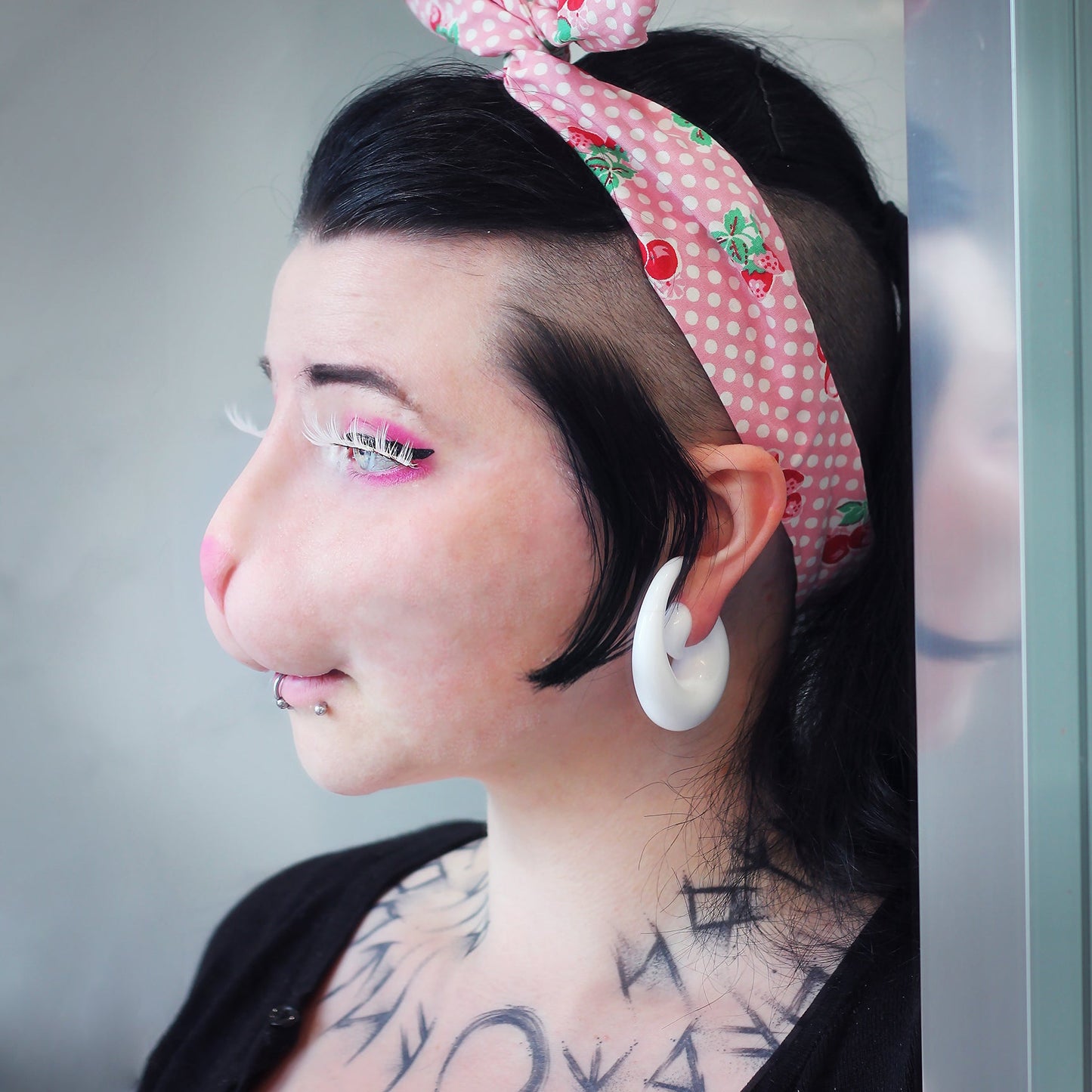 Woman with black hair wearing a bunny nose prosthetic in vanilla shade