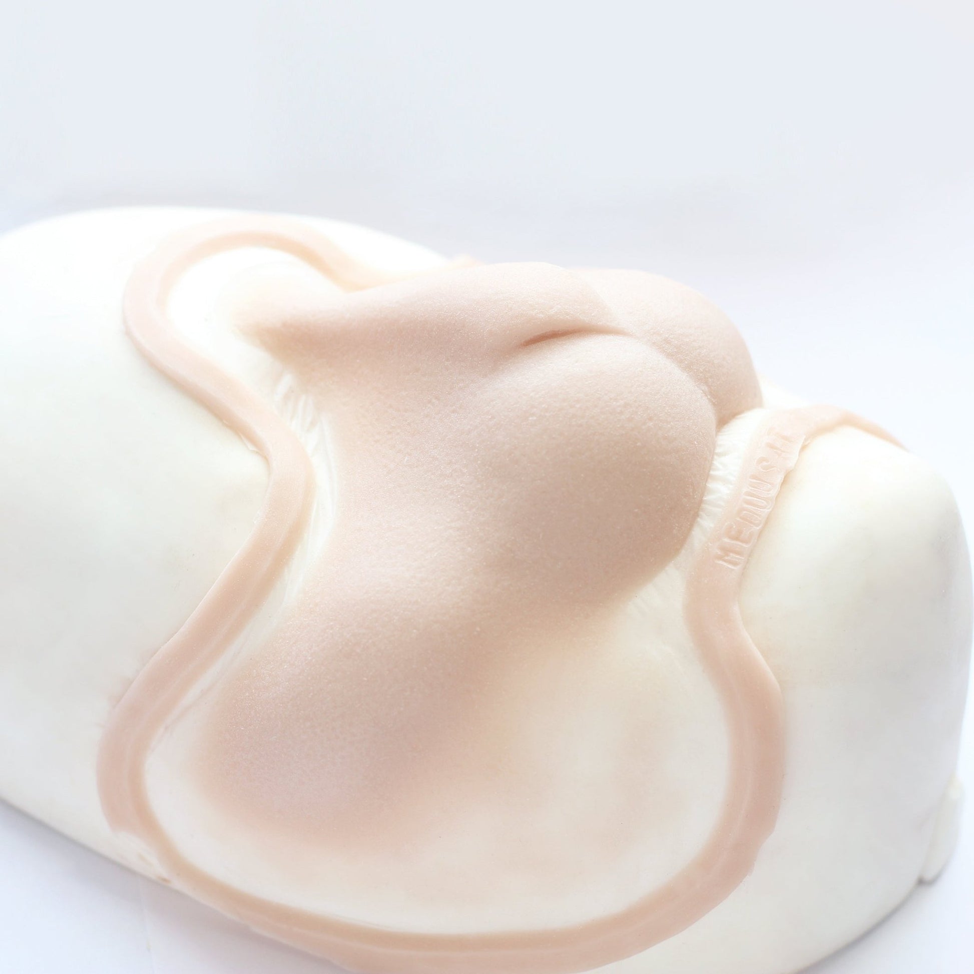 Bunny Nose - Silicone makeup prosthetic in vanilla shade on a white surface