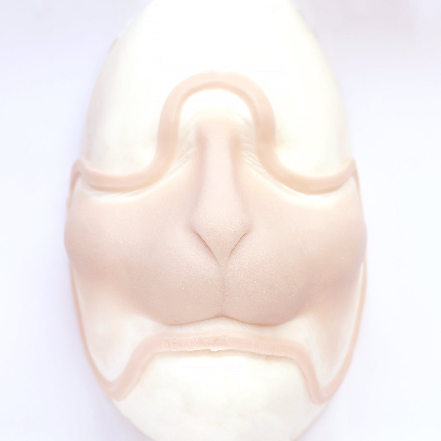 Bunny Nose - Silicone makeup prosthetic in vanilla shade on a white surface
