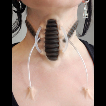 Cyborg Neck Piece, with black makeup, on a neck