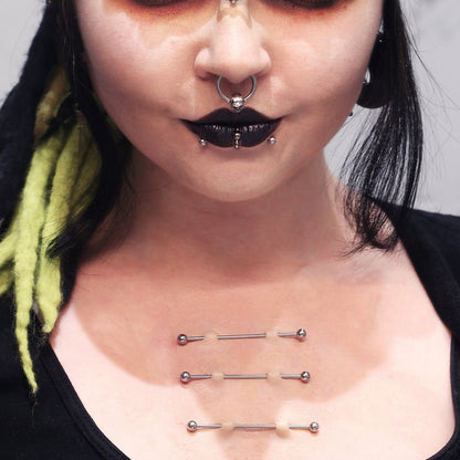 Three pairs of Double Surface Piercings on a woman's chest