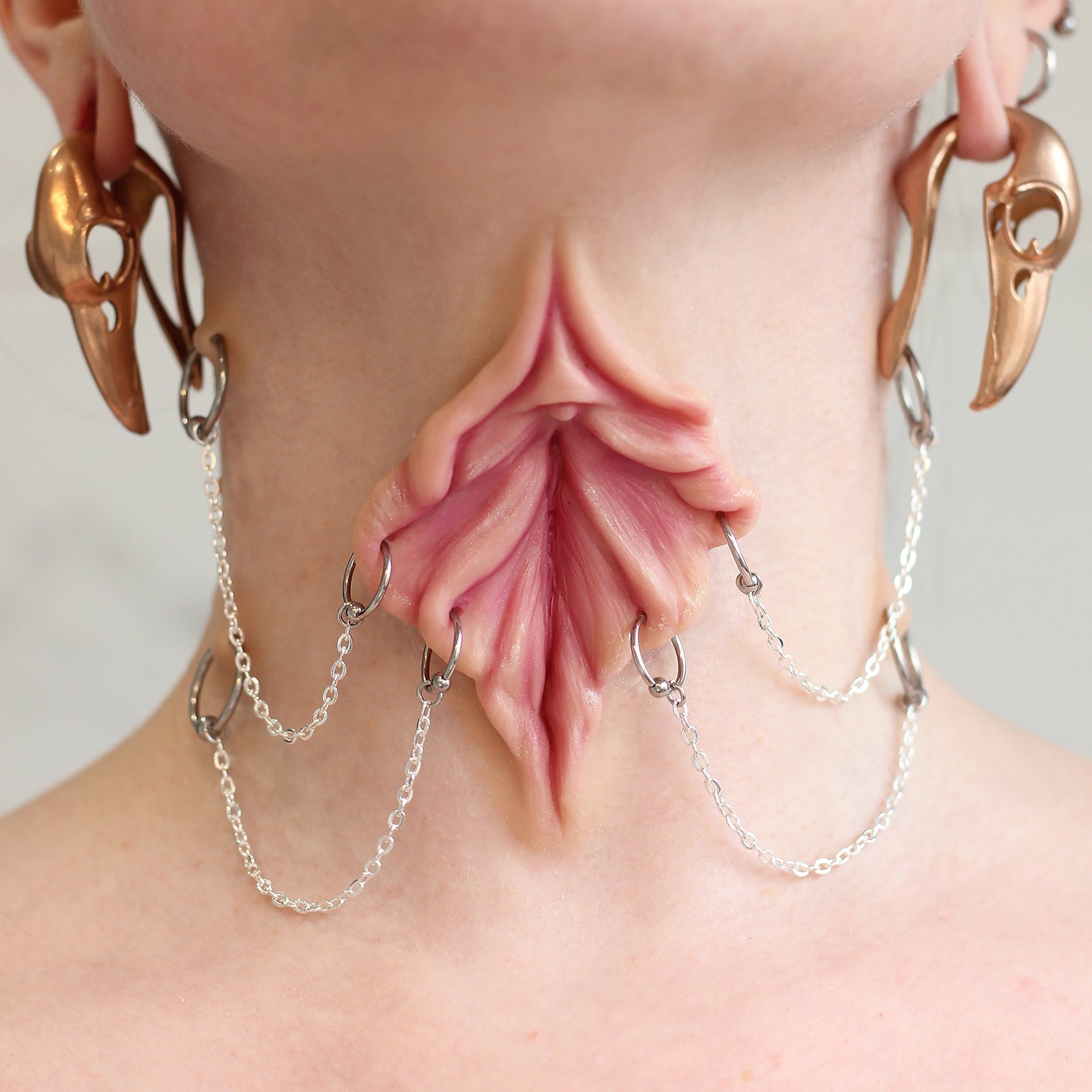 Woman's neck with a flower choker prosthetic