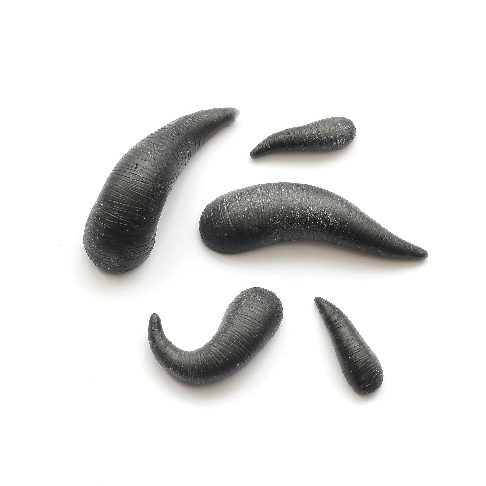 Leeches - Silicone makeup prosthetic in black on a white surface
