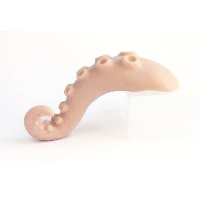 Tentacle Tongue - Silicone makeup prop in vanilla shade on a white surface