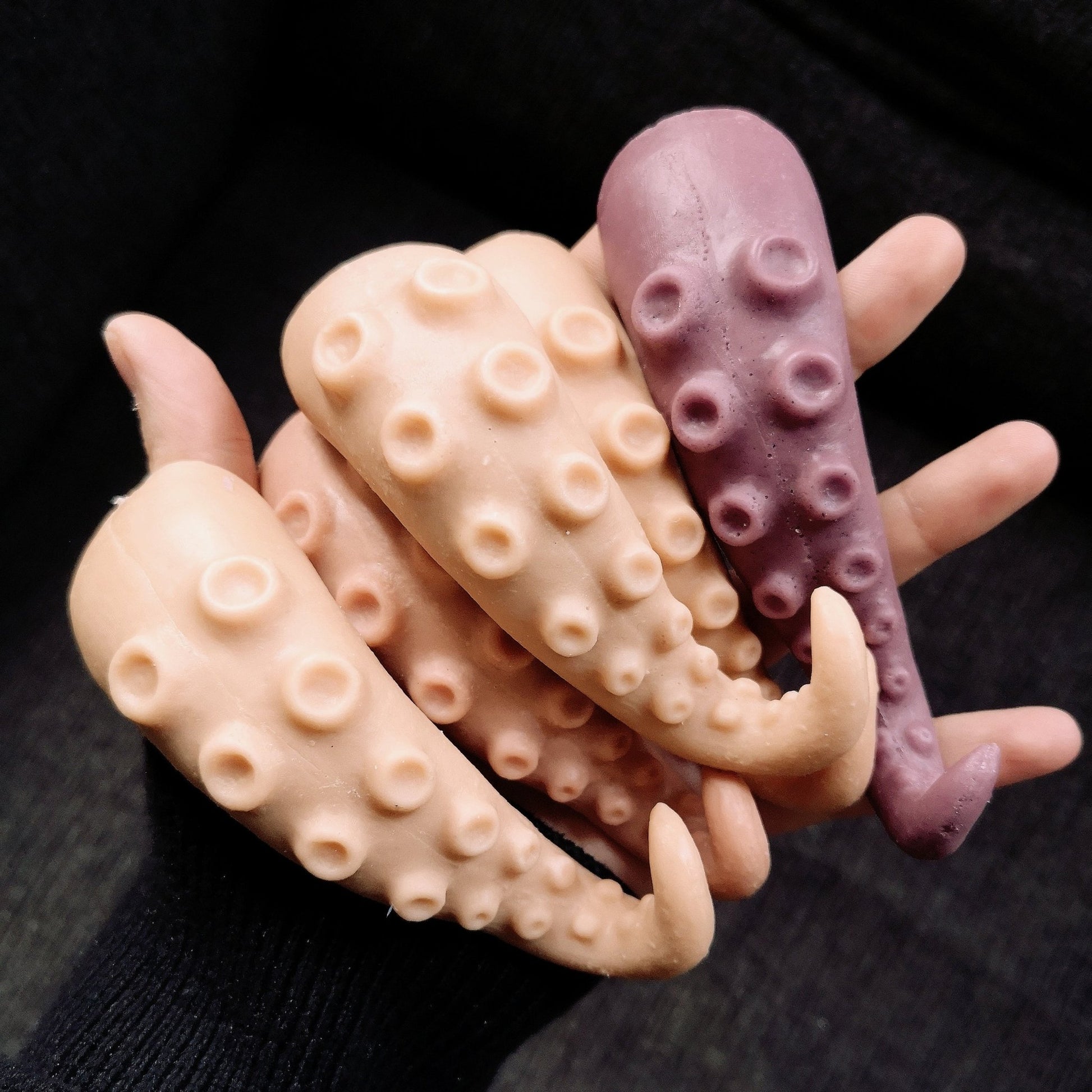 Tentacle Tongue - Silicone makeup props in different custom shades in the palm of a hand